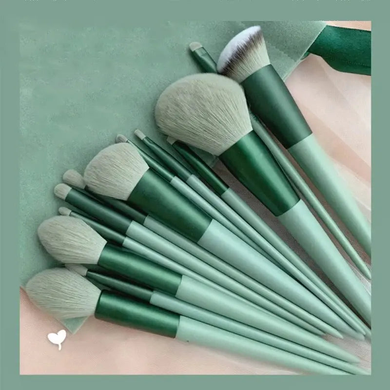 Set of green makeup brushes on a matching green background